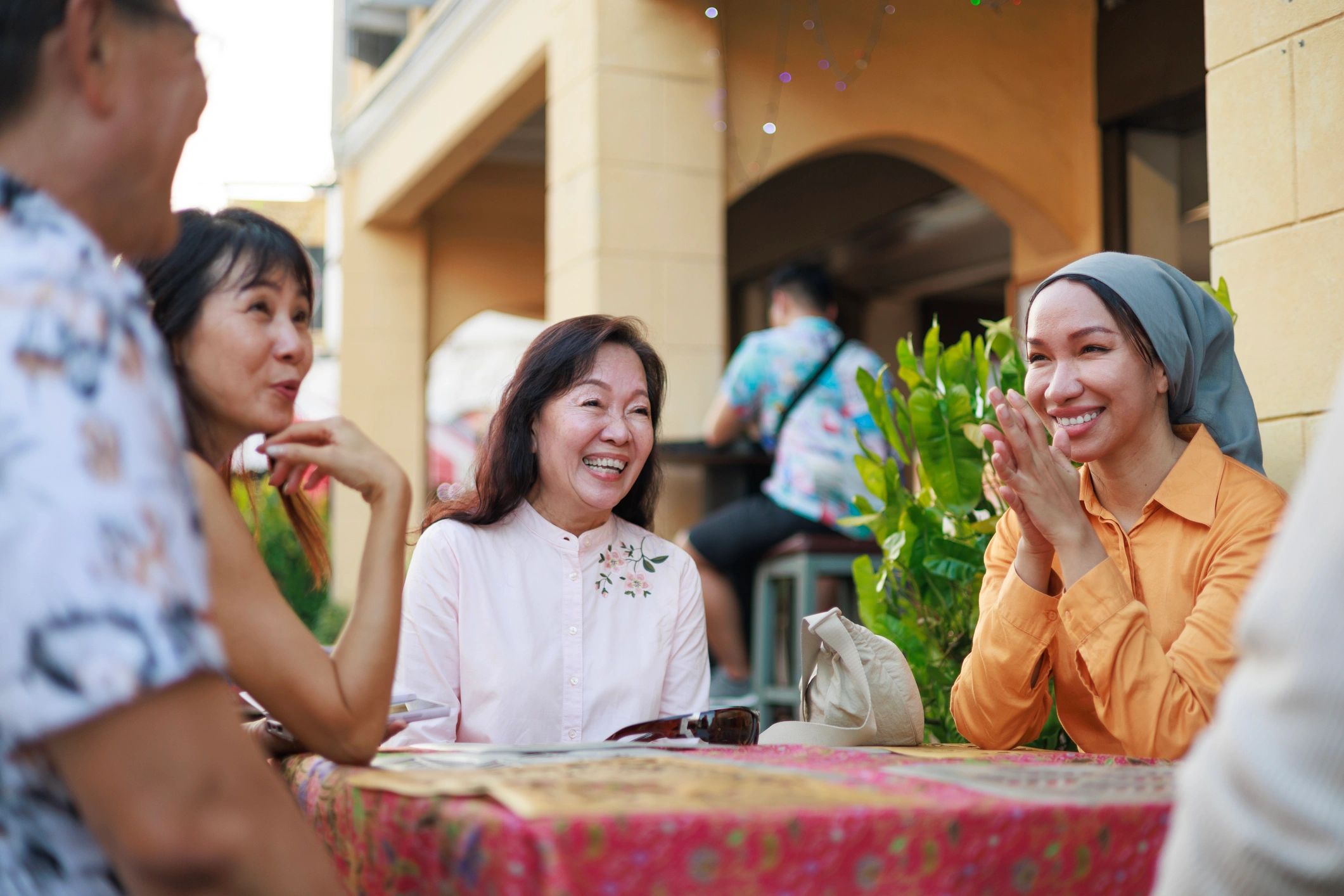 Friends enjoying Penang street food together