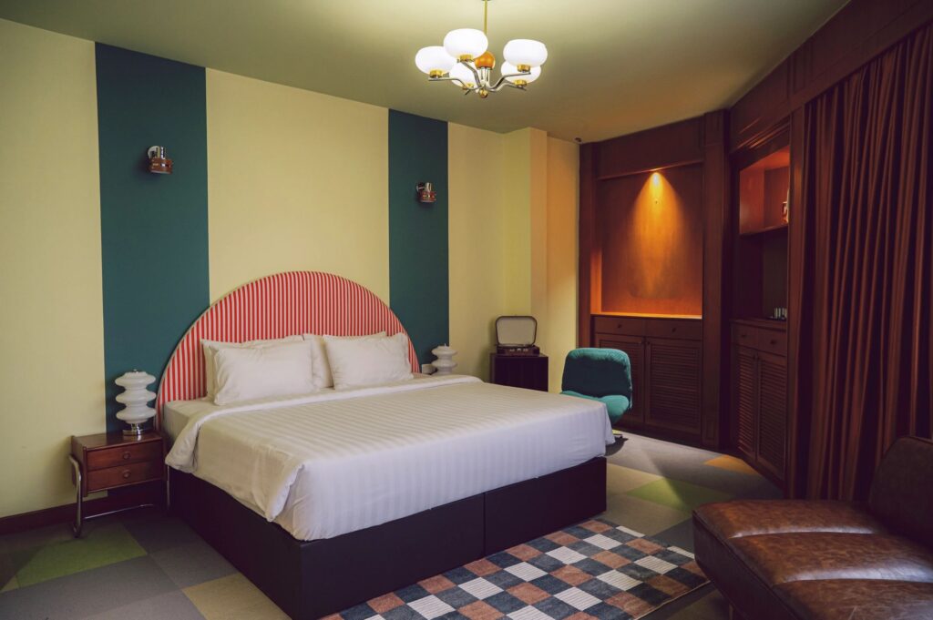 Retro Boutique Hotel Bedroom with Double Bed, Accent Wall, and Vintage Decor