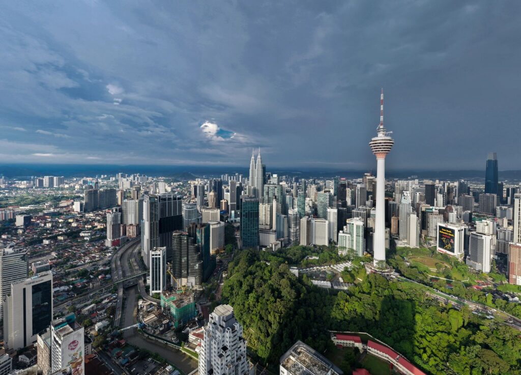 Kuala Lumpur cityscape under cloudy skies